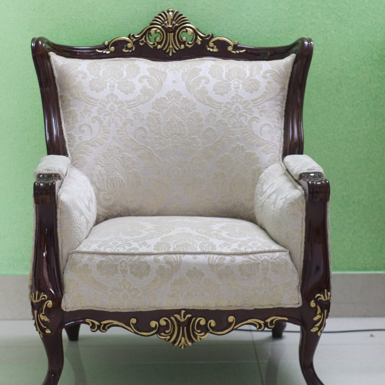 white and brown floral armchair